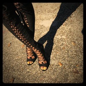 Thigh high strap heels